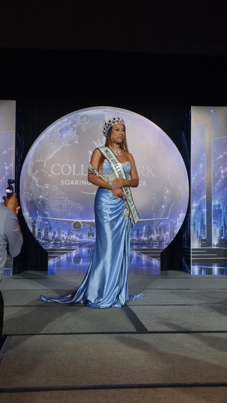 Jada on the Miss College Park stage in a powder-blue gown, crown and sash